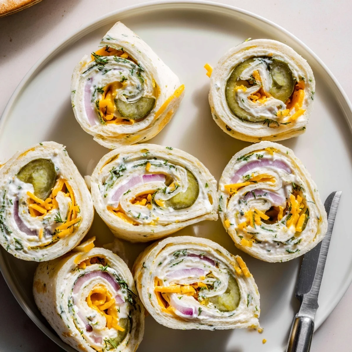 Crispy tortilla wraps filled with tangy pickles and creamy cheese delight.  