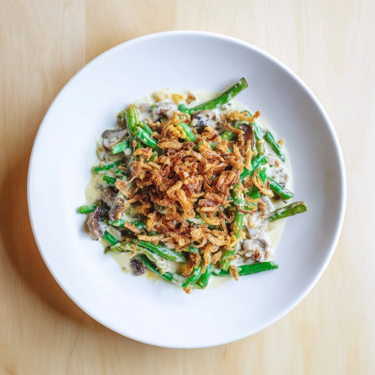Warm, bubbly Old-School Green Bean Casserole with a crispy fried onion topping, perfect for any holiday table.