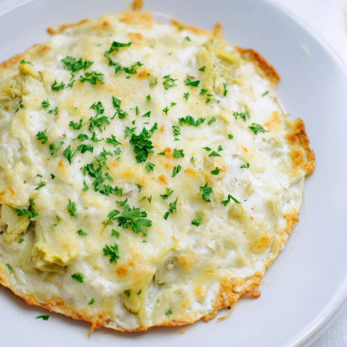 Savory Baked Artichoke Dip, a bubbling, flavorful appetizer perfect for any get-together.