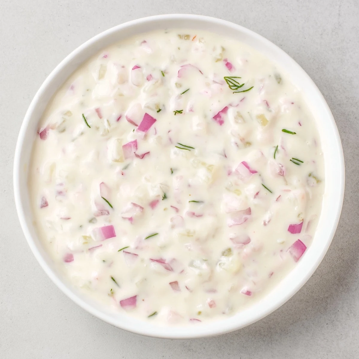 A creamy Sweet and Sour Pickle Relish Dip served with colorful chips, inviting a flavorful appetizer.