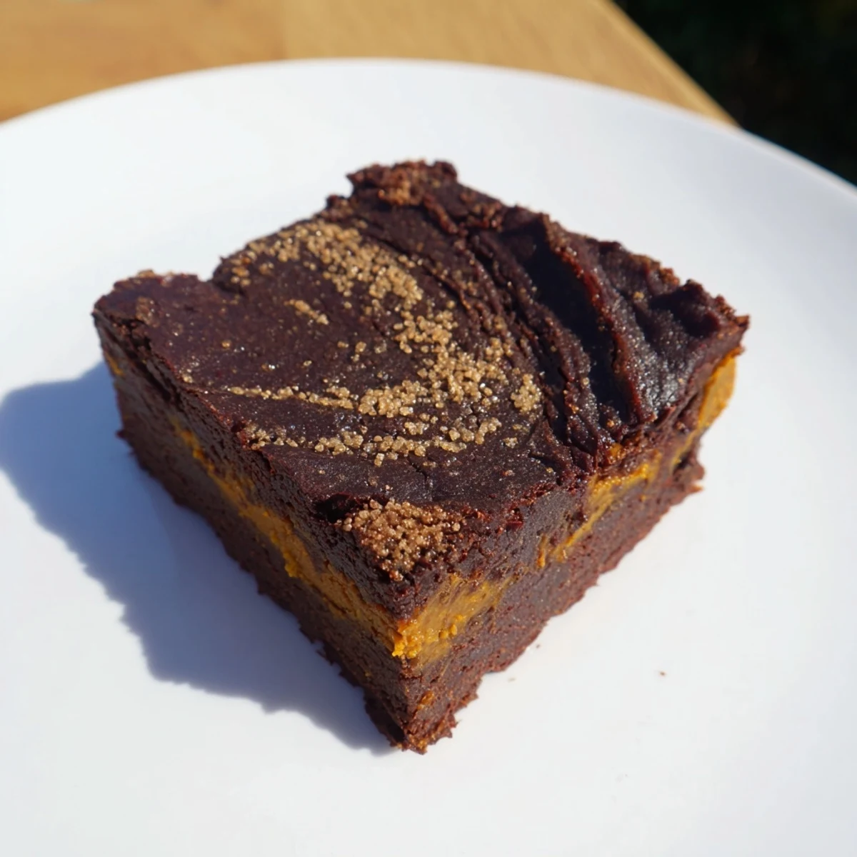 Fudgy Pumpkin Workout Brownies, swirled with deep chocolate, cooling on a parchment-lined baking sheet.