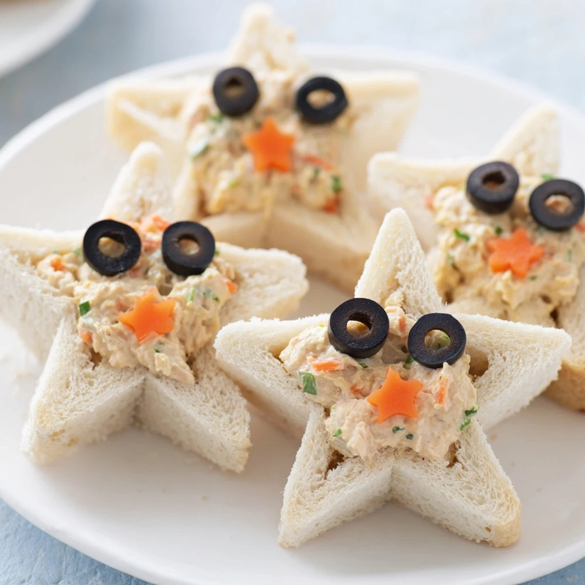 These adorable mini starfish sandwiches feature a creamy tuna filling between soft, crustless white bread stars.