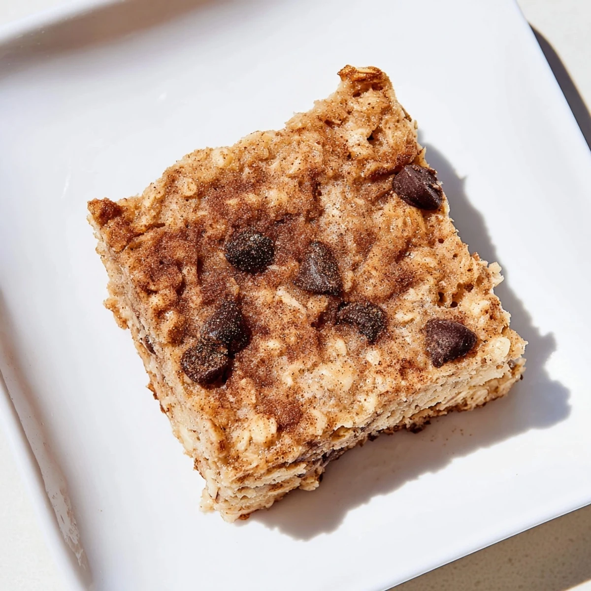 Warm, comforting square of baked oats that taste like cake, topped with a drizzle of your favorite toppings.