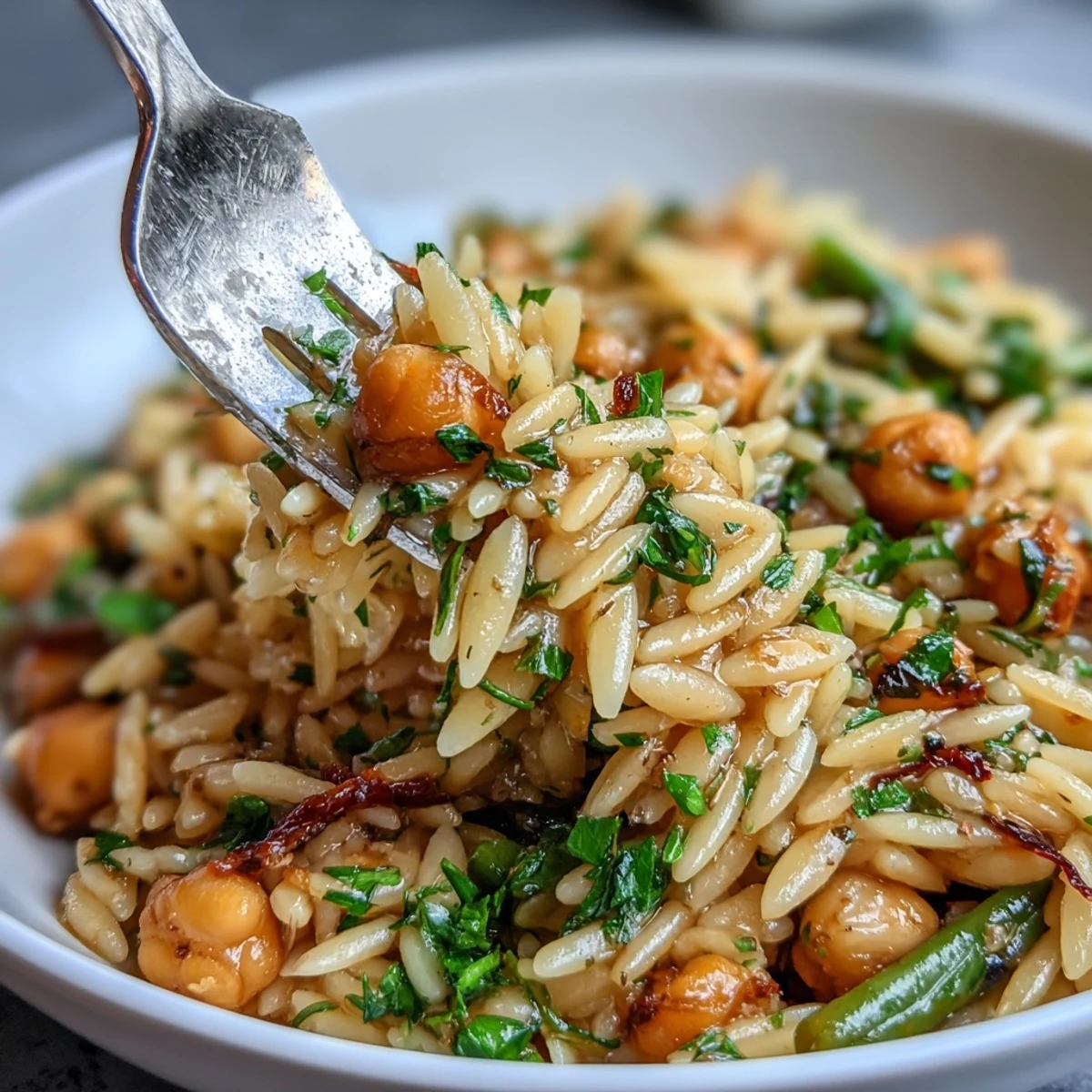 Bright Mediterranean-inspired one-pot meal featuring tender orzo, protein-rich chickpeas, and seasonal spring veggies.
