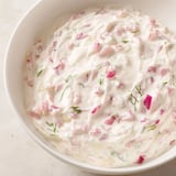 This vividly textured Sweet and Sour Pickle Relish Dip features red onion and fresh dill, ready to serve.