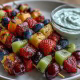 Bright and refreshing Rainbow Fruit Skewers with Honey Dip, featuring strawberries, pineapple, and kiwi, perfect for summer parties and kids' treats.