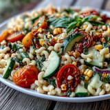 This easy summer corn and tomato pasta salad tastes refreshing with bright, juicy ingredients.