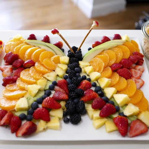 Monarch Magic Fruit Butterfly Tray with vibrant strawberries, blueberries, and kiwi, perfect for snacks.