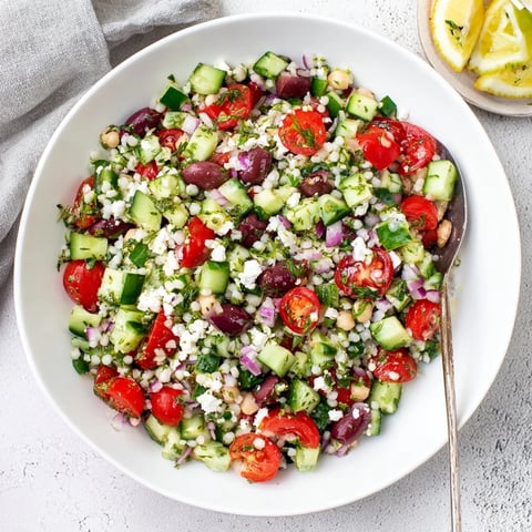 Vibrant Mediterranean Chickpea and Feta Bowl, a colorful, healthy vegan meal with fresh ingredients.
