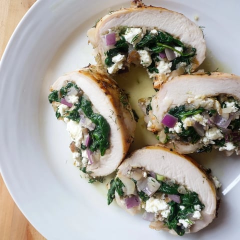 Spinach and feta-stuffed chicken, browned on the outside and baked to juicy perfection.