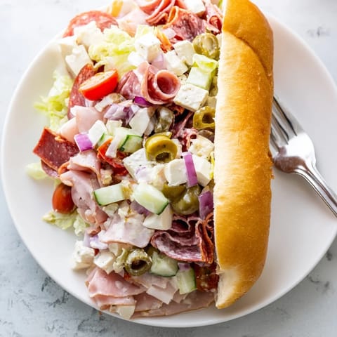 Delicious Flavor Mash-Up Sandwiches drizzled with tangy dressing and loaded with layers.  