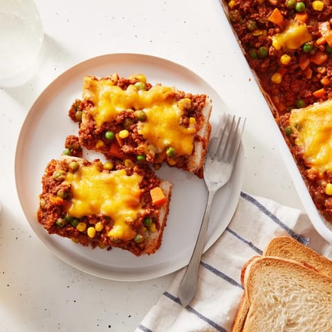 Savory 5-Ingredient Sloppy Joe Casserole with melted cheddar, served hot and ready to enjoy.