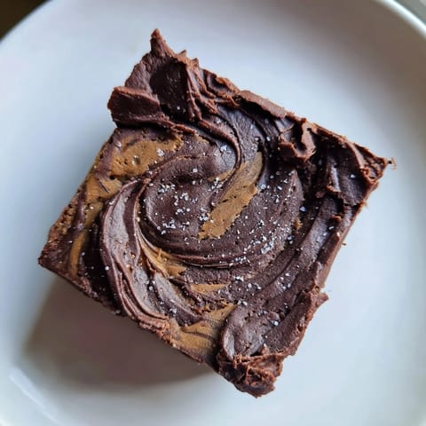 Warm, rich Pumpkin Workout Brownies ready to be sliced, inviting you to enjoy a guilt-free dessert.