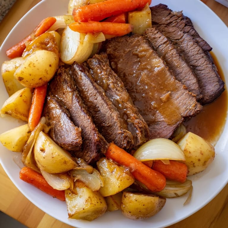 Fork-tender beef and colorful roasted vegetables in this hearty Sunday Pot Roast meal.