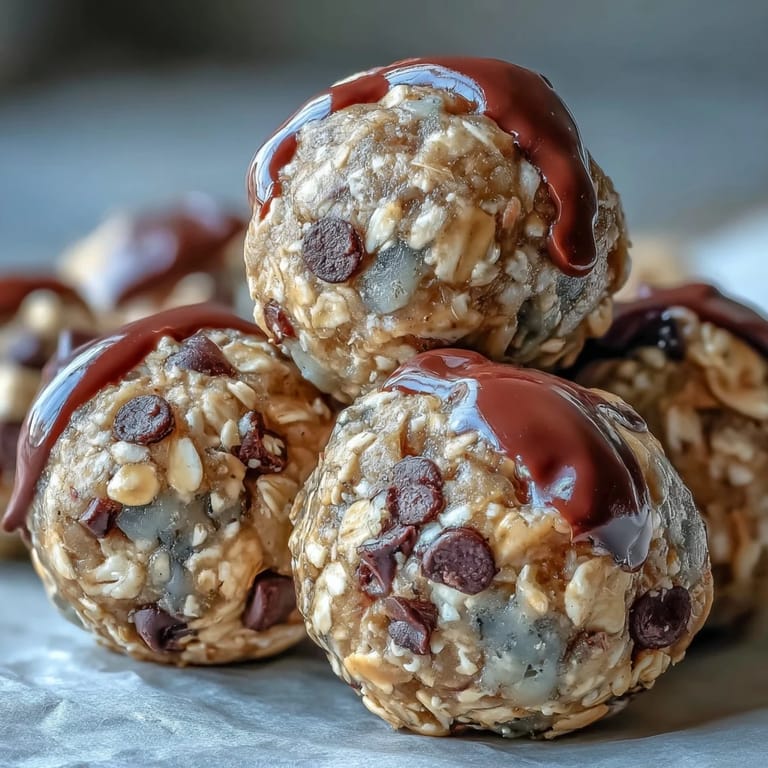 Golden brown banana chocolate chip energy balls resting on parchment paper.